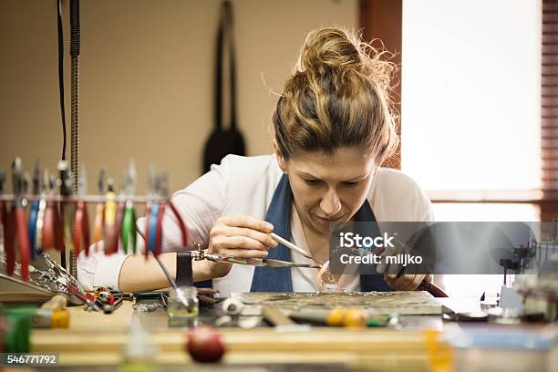 Woman Designer Makes And Design Jewelry In Workshop Stock Photo - Download Image Now