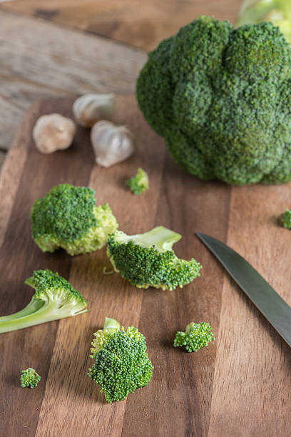 istock Fresh broccoli on the wooden cutting board. 546771948