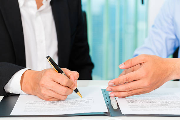 istock business people sign agreement 546775686