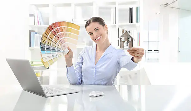 Photo of smiling woman in office, concept for architecture and constructi