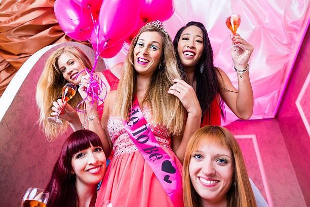 Women having bachelorette party in night club Bride and friends celebrating hen night in club bachelor and bachelorette parties stock pictures, royalty-free photos & images