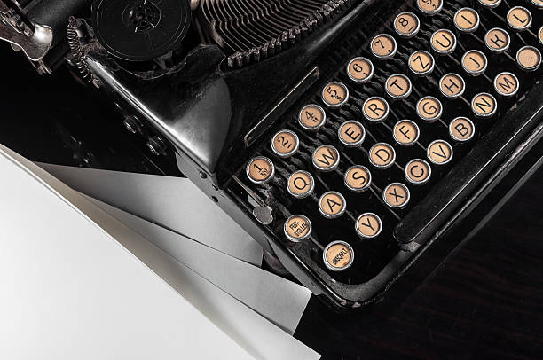 istock Retro Typewriter and blank sheets of paper 546778174