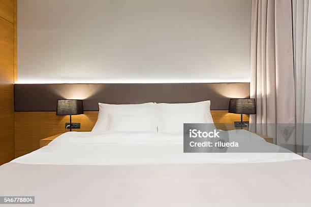 Luxury Hotel Bedroom In The Evening Stock Photo - Download Image Now - Bed - Furniture, Elegance, Hotel