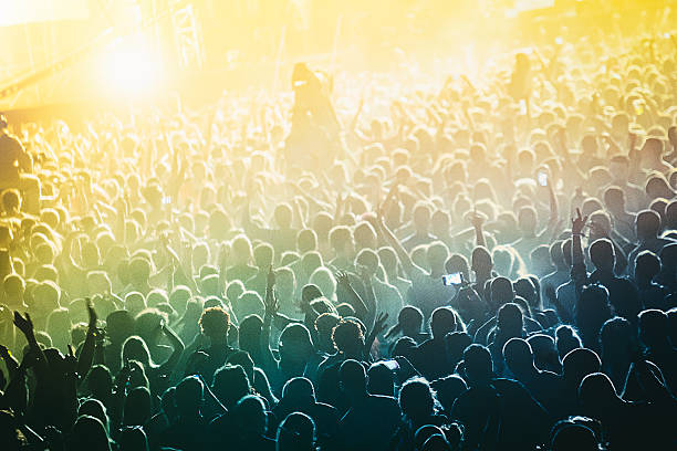 istock concert crowd in front of bright stage lights 546779572
