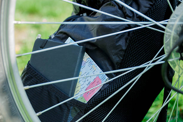 istock bicycle and Backpack with tourist equipment. bicycle wheel, closeup 546780256