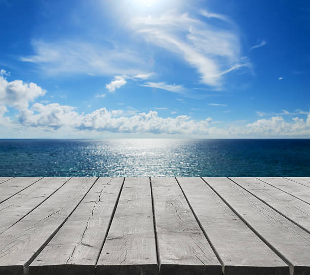 istock Wooden platform beside tropical sea 546781098