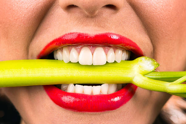 Biting Celery stock photo