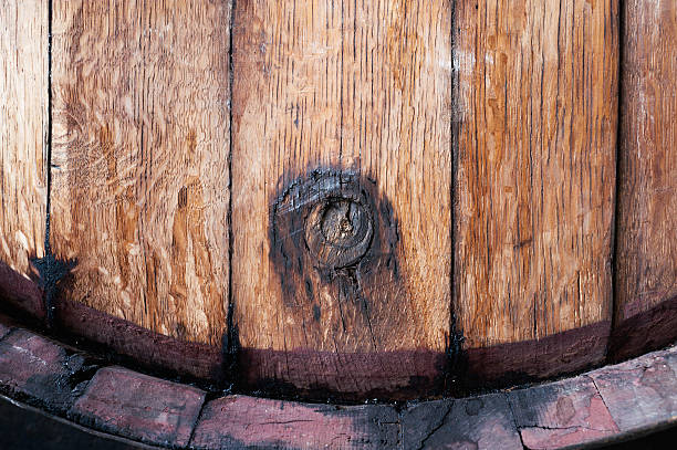 istock Old oak wine barrel with wine drips, leak traces 546782924
