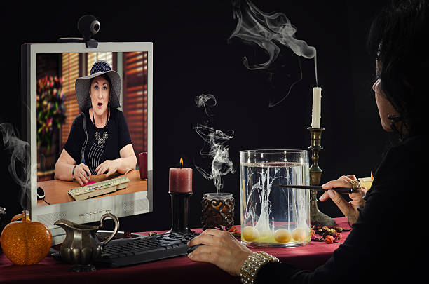 Online divination by eggs Psychic is doing egg divination online. Black haired fortune teller is reading a shapes of egg whites in glass jar for older woman with shocked facial expression in monitor screen. oracular stock pictures, royalty-free photos & images