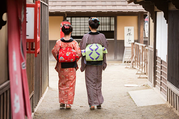 istock Traditionally Dressed Japanese Women in Kimonos Walking 546784698