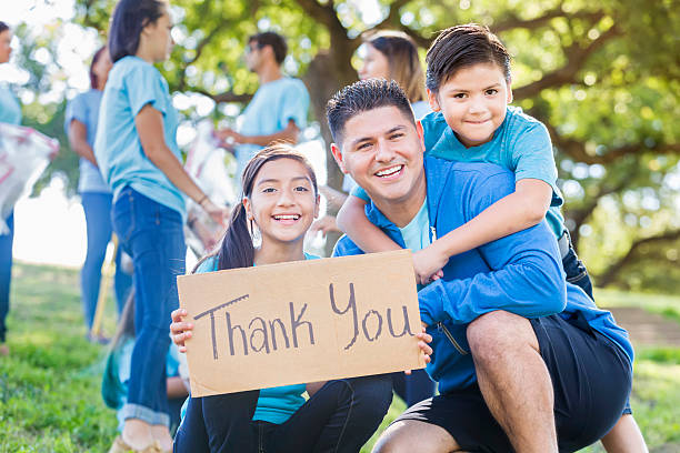 istock Hispanic father with son and daughter after park cleanup event 546785740