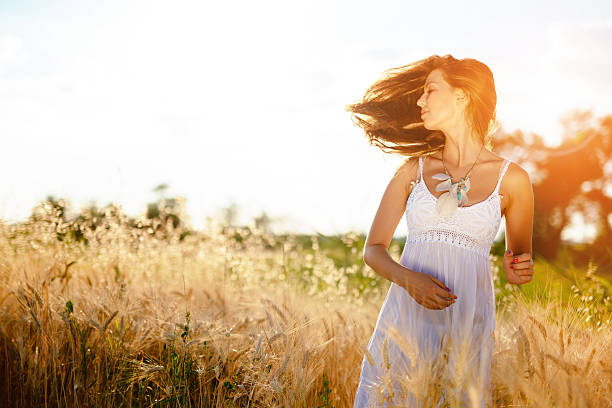 istock Beautiful woman in barley fields 546786058