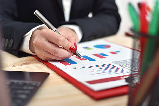 istock woman hand checks report 546786102