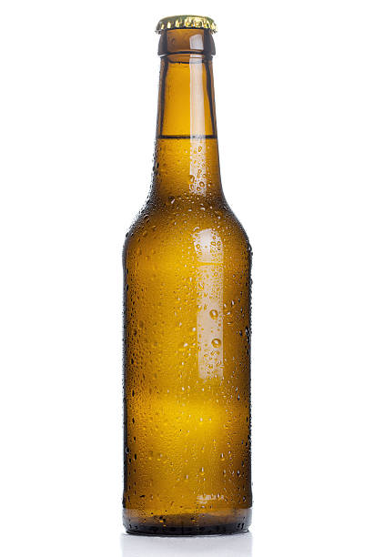 istock brown beer bottle with drops isolated on white background 546786136