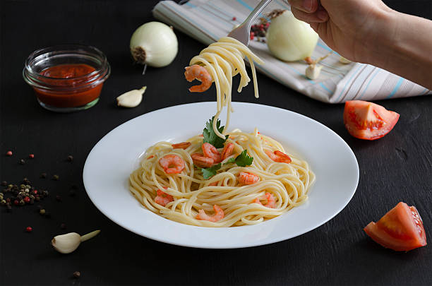 istock Pasta with shrimps and tomato sauce 546786388