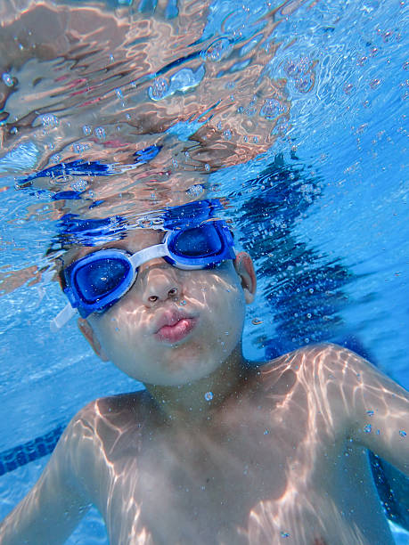 istock Boy underwater in a swimming pool 546786752