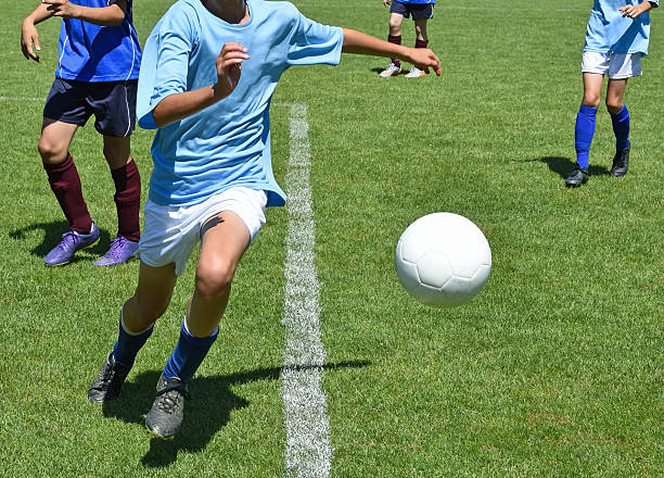 istock Kids are playing soccer 546787024