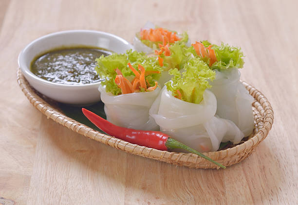 istock spring rolls with spicy sauce, vegetables and in noodle tube. 546789864