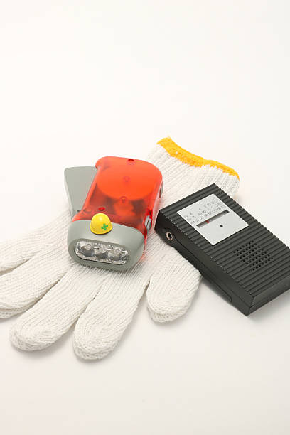 istock Helmet, portable radio, work gloves, and flashlight on white background. 546789914