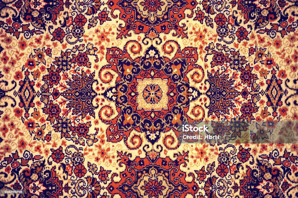 Persian Carpet. Persian Carpet. Closeup of national popular antique oriental backdrop, beautiful artistic, texture. Abstract repeating design of red blue flower on yellow color style background wallpaper texture. Carpet - Decor Stock Photo