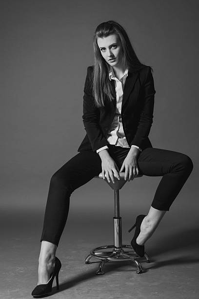 istock girl model posing in the Studio on a Chair 546792726