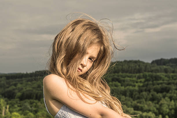 sunny の少女 - blond hair overcast sun sky ストックフォトと画像