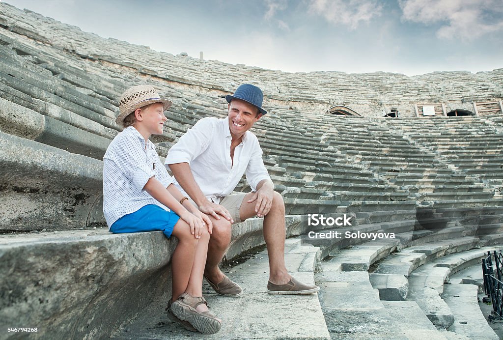 Father and son spent time together in Turkey Father and son spent time together on antique ruins amphitheater Side,Turkey Child Stock Photo
