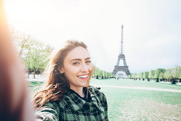 istock Happy young woman making selfie in front of Eiffel tower 546794604
