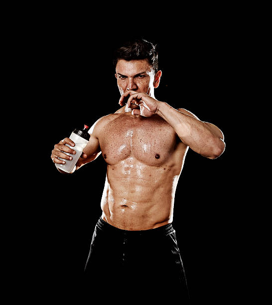 istock attractive strong sport man drinking water holding bottle sweating 546796138