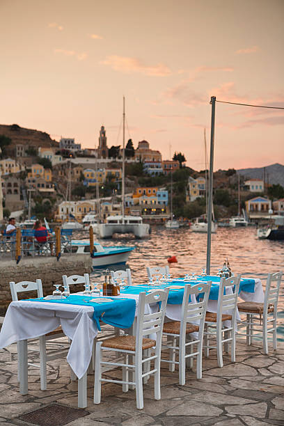 istock Restaurant Tables in Symi, Greece 546796280