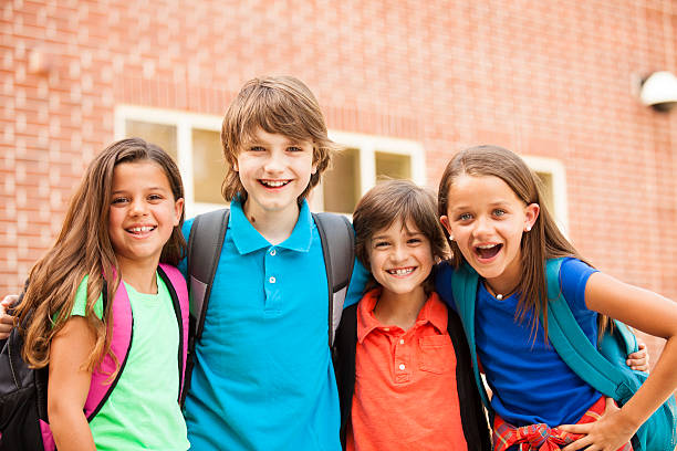 istock Back to School:  Elementary-age children, friends on school campus. 546797070