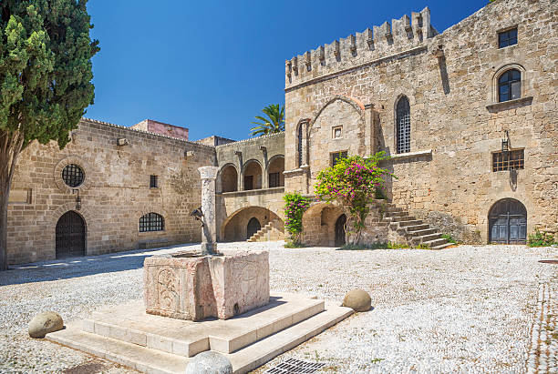 istock Fountain in a Medieval Square, Rhodes Town, Rhodes, Greece 546797890