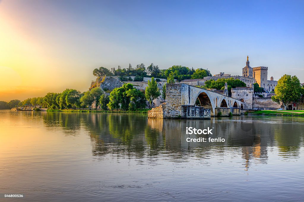 The Pont Saint Benezet The Pont Saint Benezet and the Palais des Papes in Avignon, South France Avignon Stock Photo