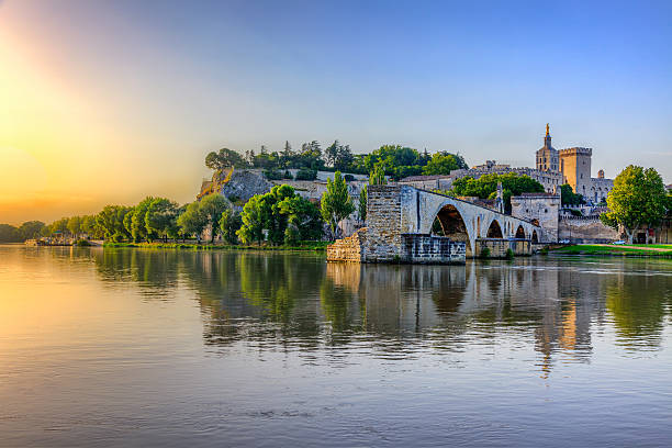 The Pont Saint Benezet The Pont Saint Benezet and the Palais des Papes in Avignon, South France avignon france stock pictures, royalty-free photos & images