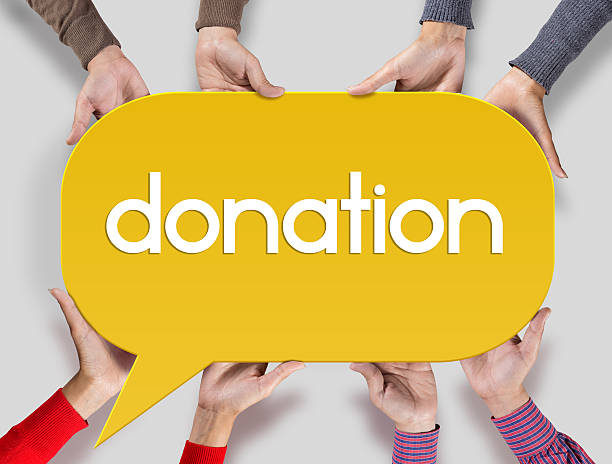 istock Group of friends showing donation on speech bubble 546802654
