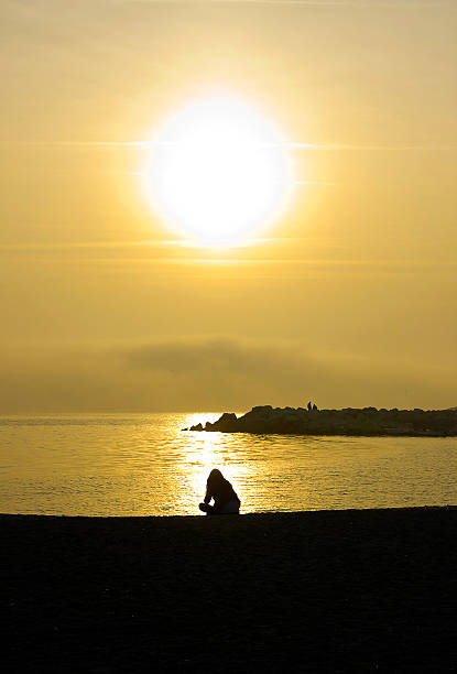 Beautiful young woman at sunset.