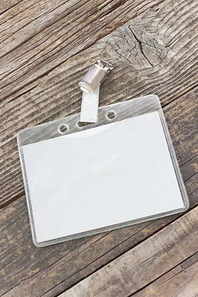 istock Blank ID card tag on wooden background 546804126