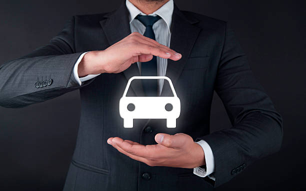 istock Businessman holding car 546805490