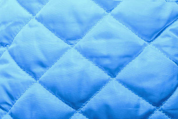 istock quilted fabric texture of white color for hammering, 546805596