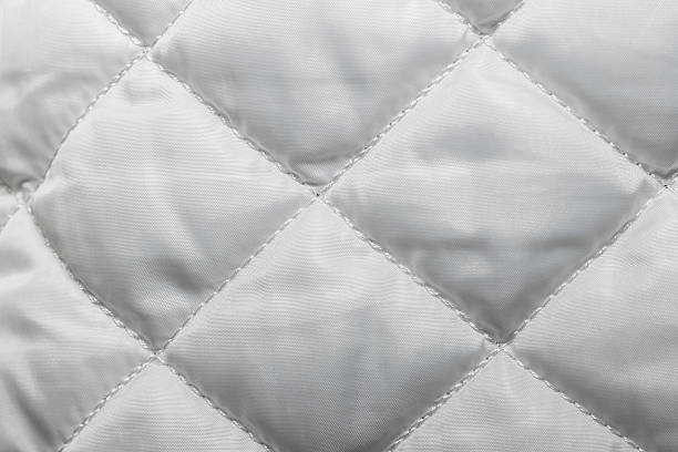istock quilted fabric texture of white color for hammering, 546807338