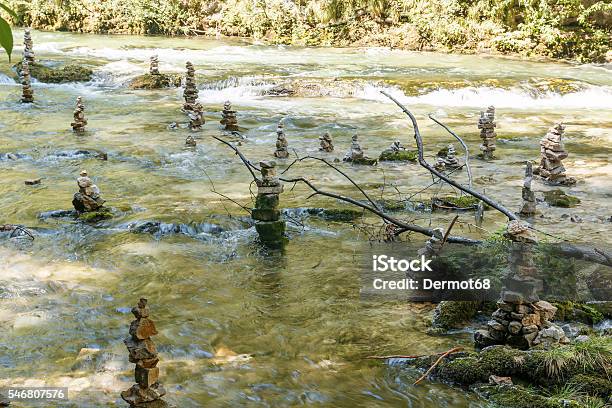 Closeup Of Stone Statues In The Water Stock Photo - Download Image Now - Animal, Balance, Brown