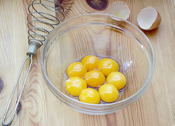 Chicken egg yolks in a glass bowl. Cooking.