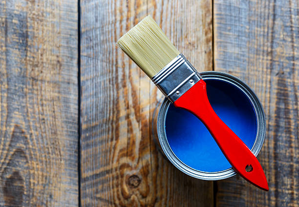 istock jar with blue paint on the wooden background top view 547009666
