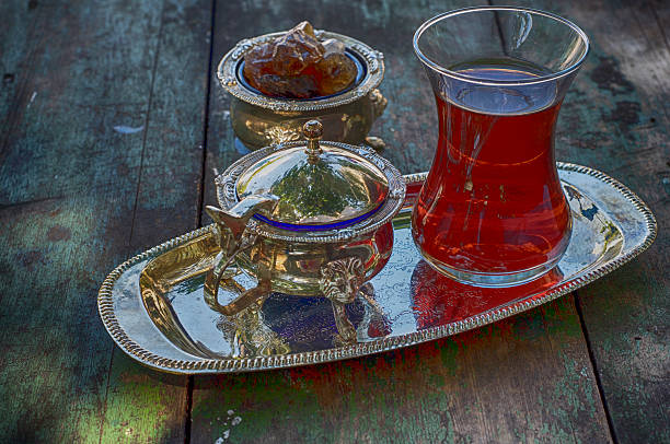 istock Black tea in a traditional Turkish cup on a  platter 547010882