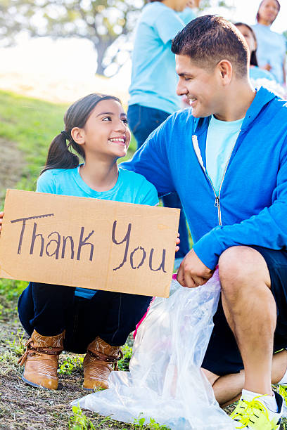 istock Loving father and daughter during park clean up event 547010942