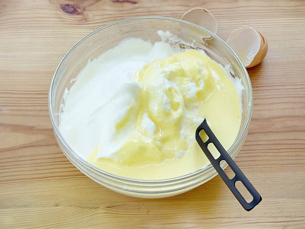 istock mix pounded chicken egg yolks with sugar and beaten egg whites 547011848