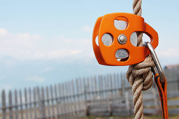Orange Climbing Pulley with rope and carabiner
