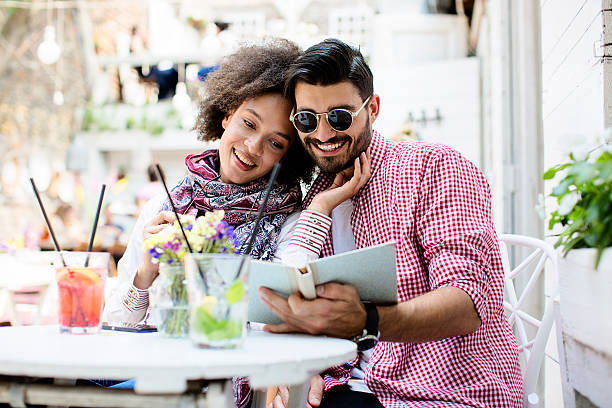 istock Beautiful young couple in caffe bar 547014622