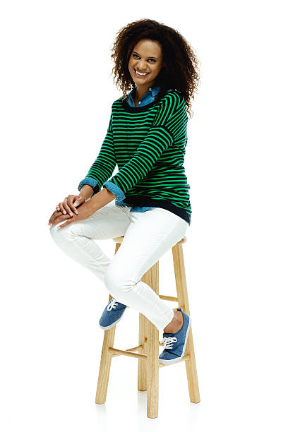 istock Cheerful woman sitting on stool 547015956
