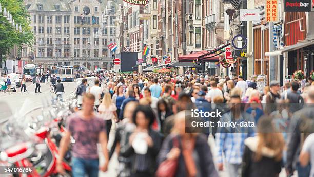 Amsterdam Damrak Road Stock Photo - Download Image Now - Amsterdam, City Street, People